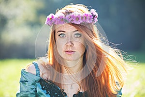 Portrait of a beautiful redheaded freckled woman photo