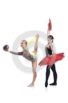 Portrait of beautiful rhytmic gymnast and ballerina performing art elements