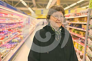 Beautiful senior woman shopping at the grocery store
