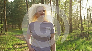 Portrait of a beautiful senior woman walking in the park.