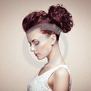Portrait of beautiful sensual woman with elegant hairstyle. Per