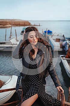 Portrait of beautiful sexual woman with makeup in fashion clothes