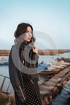 Portrait of beautiful sexual woman with makeup in fashion clothes