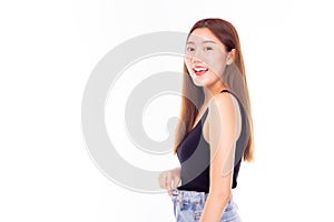 Portrait beautiful slim woman expressing astonishment and amazement, stretch jeans and happy of weight lost, standing over