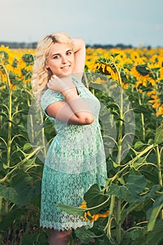 Portrait of a beautiful smiling blonde girl outdoors