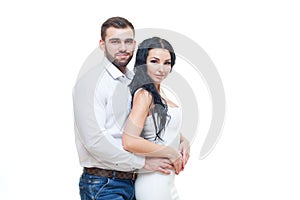 Portrait of beautiful smiling couple posing at studio over white background. valentines day theme
