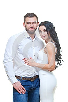 Portrait of beautiful smiling couple posing at studio over white background. valentines day theme