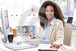 Portrait of beautiful smiling office worker photo