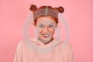 Portrait of beautiful smiling red-haired caucasian young female