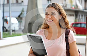 Portrait of beautiful smiling university female student goes back to school