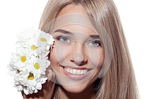 Portrait Of Beautiful Smiling Woman With Flowers. Clear Skin.