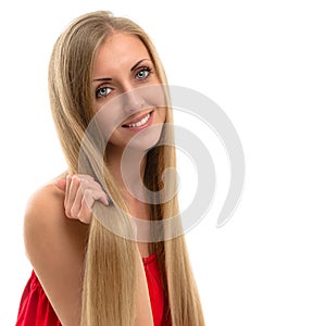 Portrait of a beautiful smiling woman with luxurious long hair