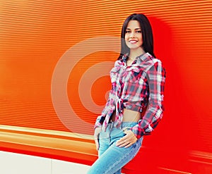 Portrait of beautiful smiling young brunette woman model in casual on background
