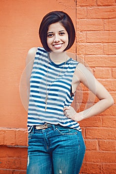 Portrait of beautiful smiling young hipster latin hispanic girl woman with short hair bob