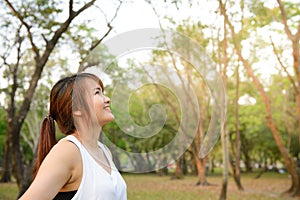 Portrait of beautiful smiling young woman enjoying yoga, relaxing, feeling alive, breathing fresh air, got freedom from work.