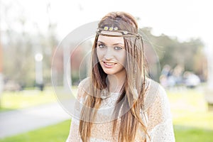 Portrait of beautiful and smiling young woman, hippie stylish, o
