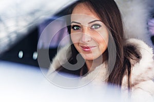 Portrait of beautiful smilling woman car driver in