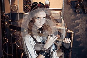 Portrait of a beautiful steampunk woman, with a telescope on a g