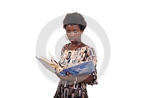 portrait of a beautiful student girl revising lessons in binder
