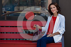 Portrait of a beautiful stylish business woman outdoors