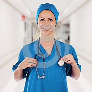 Portrait of a beautiful successful doctor in blue uniform