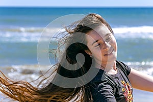 Portrait of a beautiful sunshine girl. Pretty happy young girl enjoying summer outdoors.