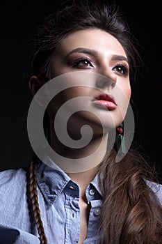 Portrait of a beautiful teen girl on a black background