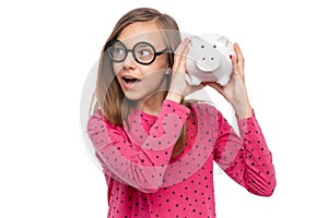 Teen girl with piggy bank