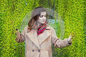 Portrait of beautiful teen girl in a spring park