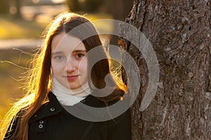 Portrait of beautiful teenage girl in the park