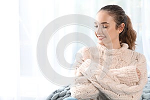 Portrait of beautiful teenage girl in warm cozy sweater