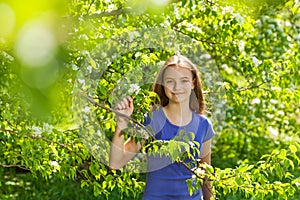 Portrait of beautiful teenager girl with pear tree