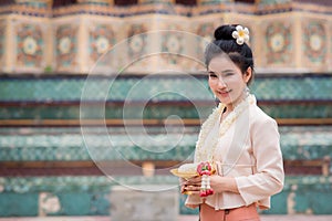 Portrait of a beautiful thai woman wearing a thai dress