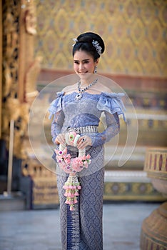 Portrait of a beautiful thai woman wearing a thai dress