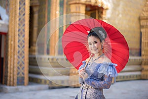 Portrait of a beautiful thai woman wearing a thai dress