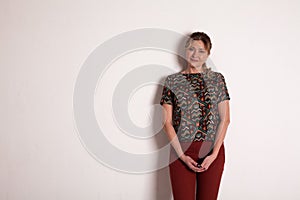 Portrait of a beautiful woman of 40 years on a white background