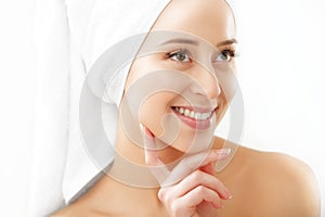 Portrait of beautiful woman applying cream on face - isolated