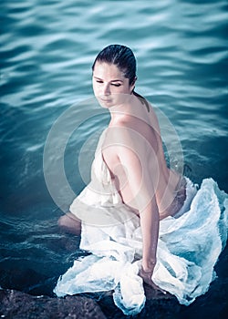 Portrait of a beautiful woman bather in a sea