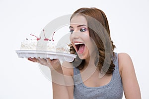 Portrait of a beautiful woman bitting cake