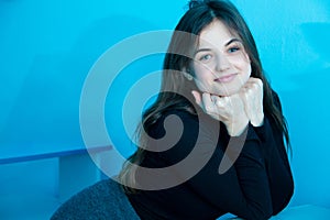 Portrait of beautiful woman on blue background