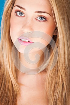 Portrait of beautiful woman on blue background