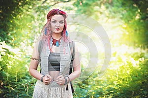 Portrait of beautiful woman boho style with red hair