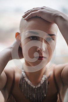 Portrait of beautiful woman, cancer awareness concept. Strong female oncology patient, determined, confident.