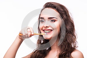 Portrait of a beautiful woman, cleans teeth with toothbrush