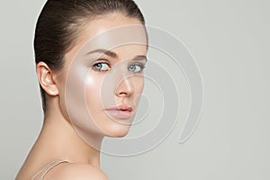 Portrait of beautiful woman with clear skin. Skincare and facial treatment concept