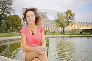 Portrait of a beautiful woman with curly hair in a