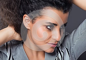 Portrait of beautiful woman with curly hairs