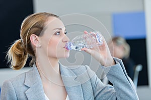 Portrait of beautiful woman drinking water