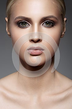 Portrait of beautiful woman face. Make up smoky eyes.