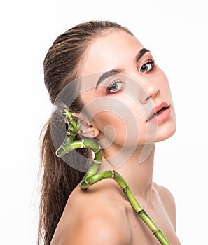 Portrait beautiful woman face portrait with green leaf , concept for skin care or organic cosmetics